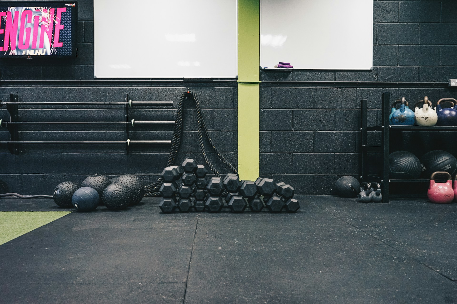 a gym with kettles, kettles and exercise mats