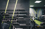 a gym with a wall of exercise equipment