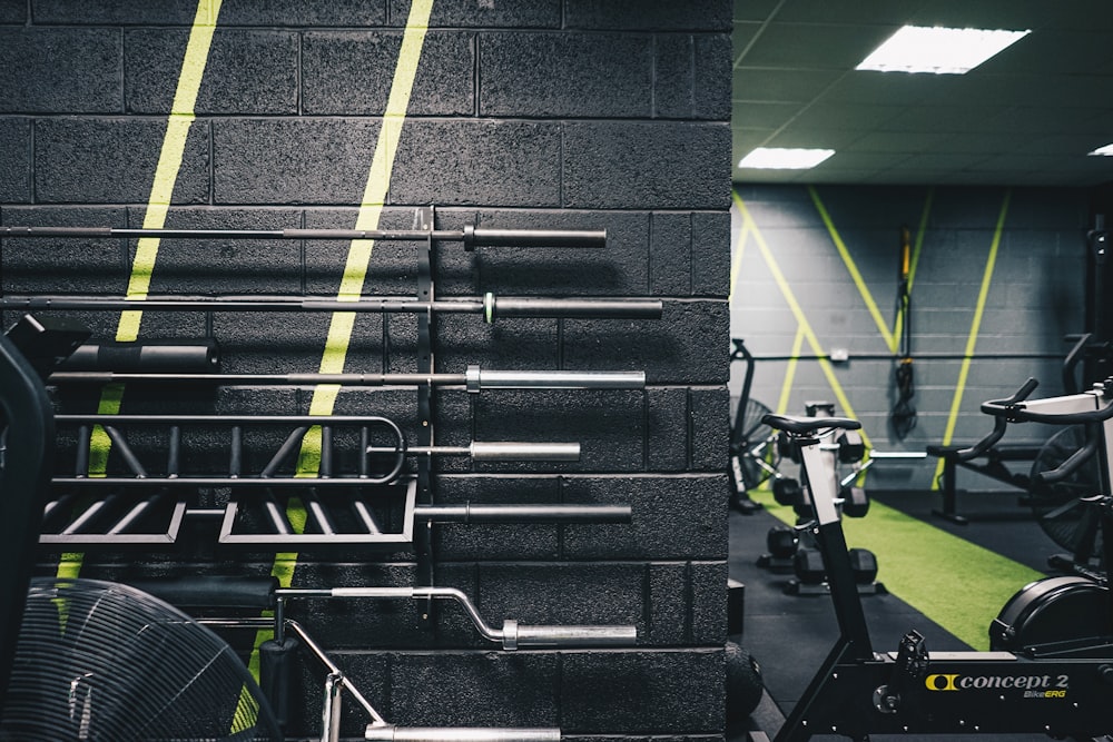 a gym with a wall of exercise equipment