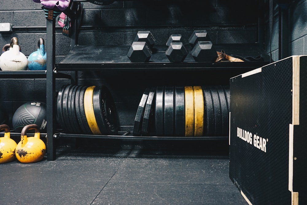 a gym area with a rack of exercise equipment