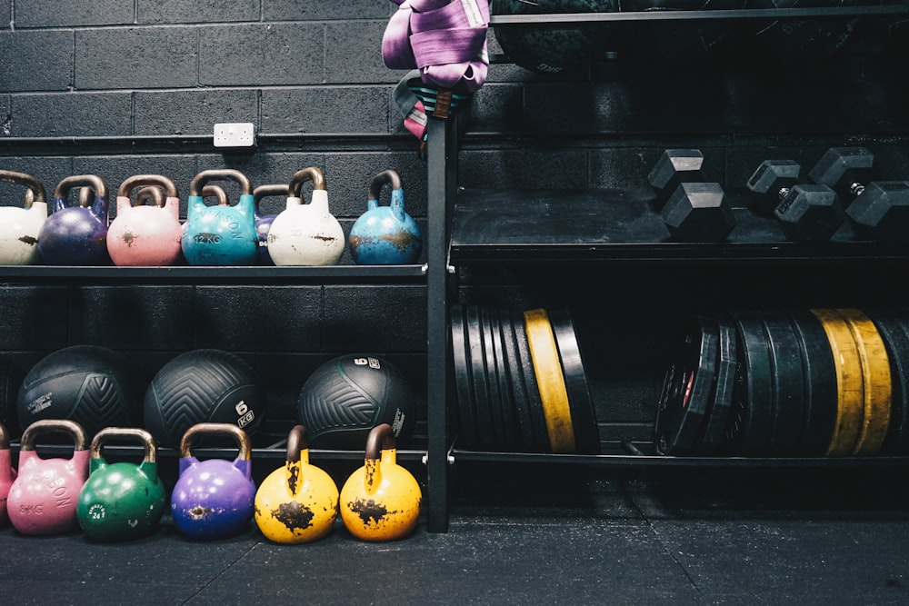 a rack of kettles and a rack of weights