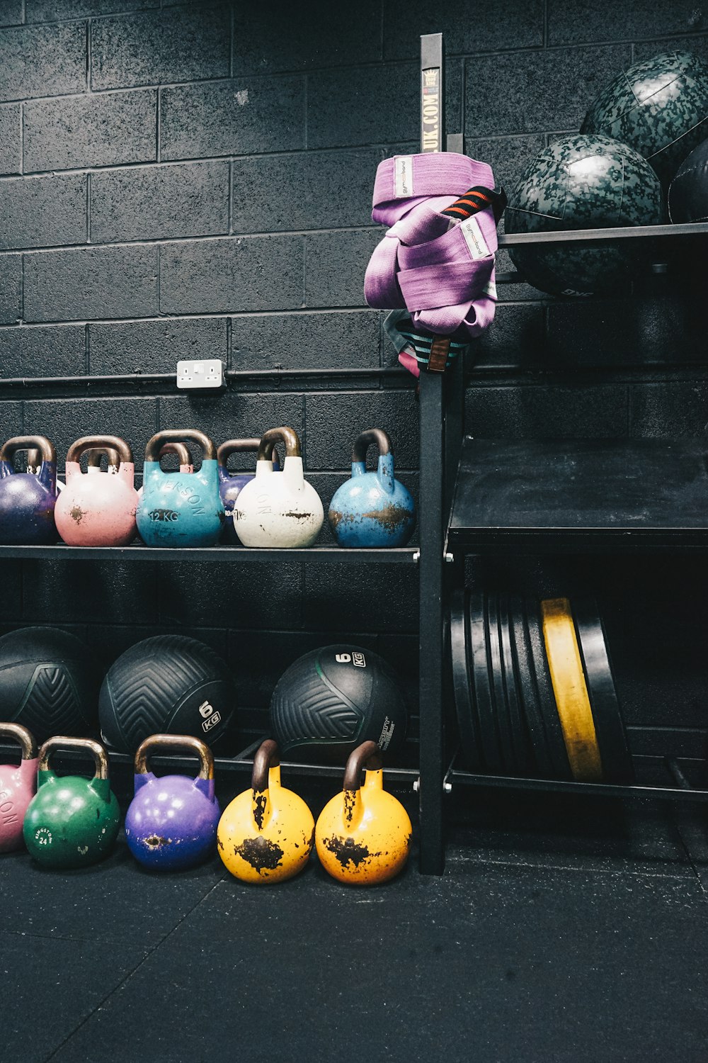 a rack of kettles and kettles in a gym