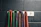 Close-up of colorful resistance bands neatly arranged on a wooden floor.