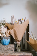 a bunch of flowers sitting on top of a wooden box