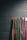 Close-up of Taekwondo belts arranged neatly on a wooden shelf.
