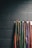 Close-up of Taekwondo belts arranged neatly on a wooden shelf.