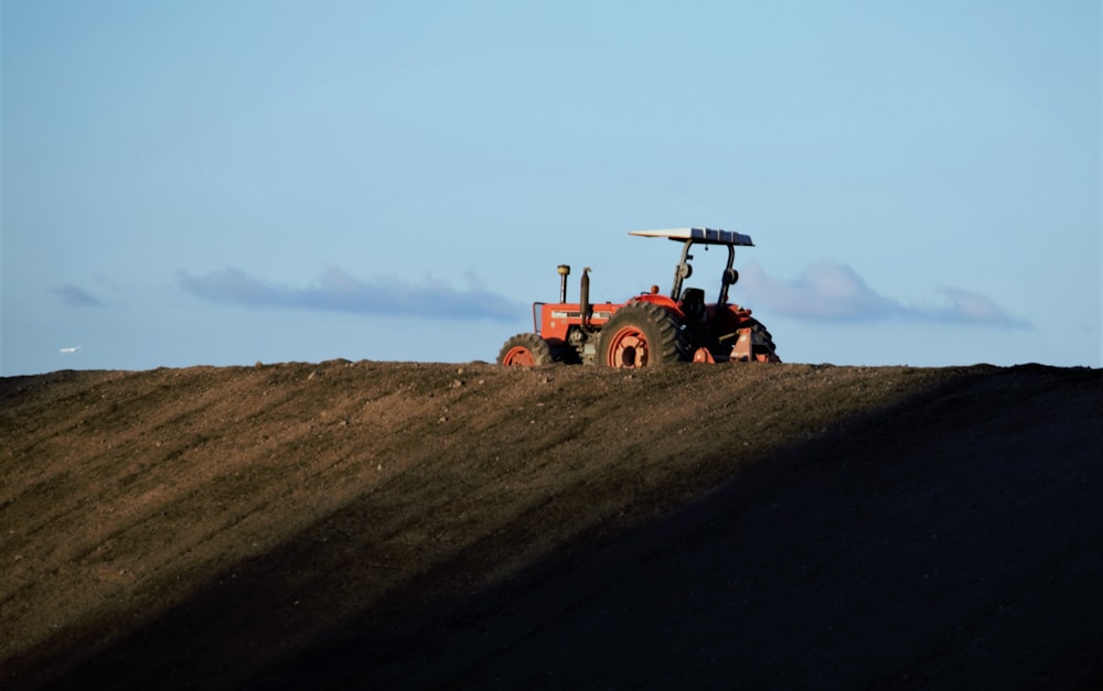 a tractor is parked on the side of a hill