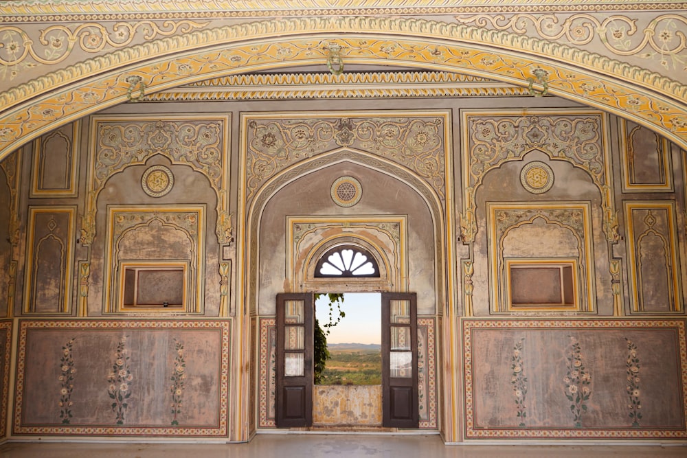 a doorway in a building with a view of a valley