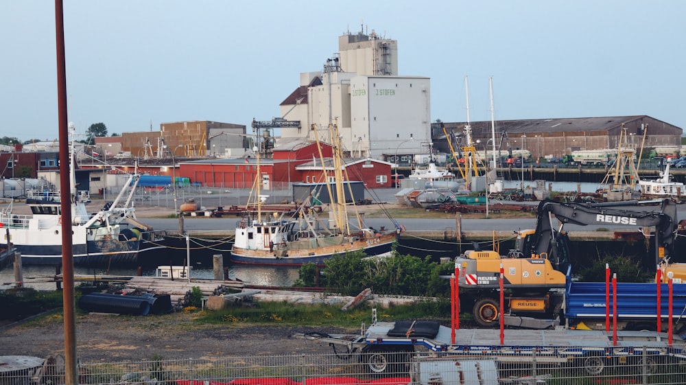 a harbor filled with lots of boats next to tall buildings