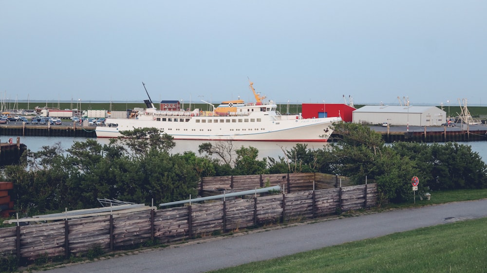 a large boat is docked at a dock