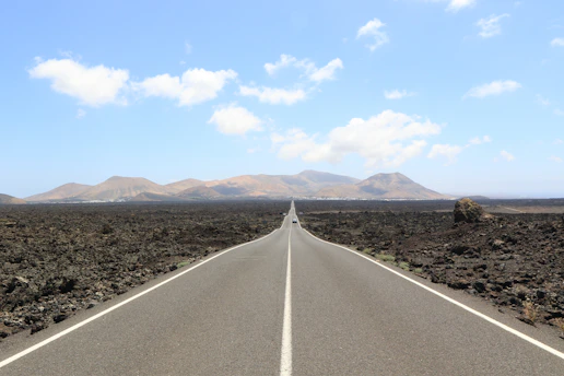 a long straight road in the middle of nowhere