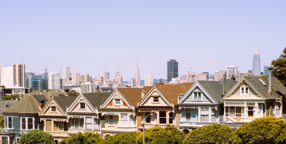 a row of houses with a city in the background