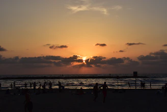 A candid photo of viajora capturing a sunset over a serene beach.