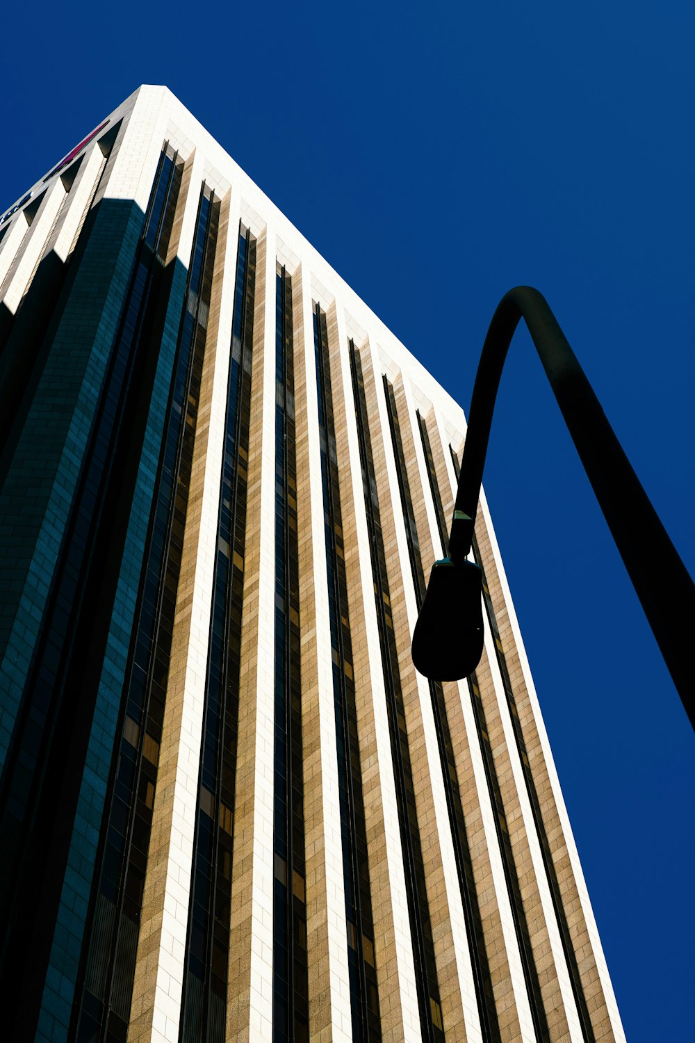 a street light in front of a tall building