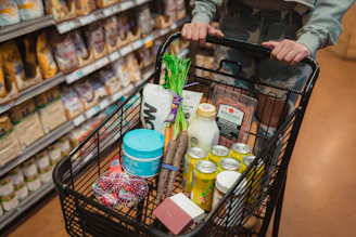 A neatly organized online shopping cart filled with various grocery items on a laptop screen.