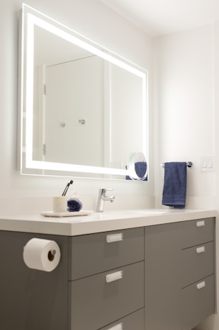 Bright bathroom with contemporary fixtures and a large mirror