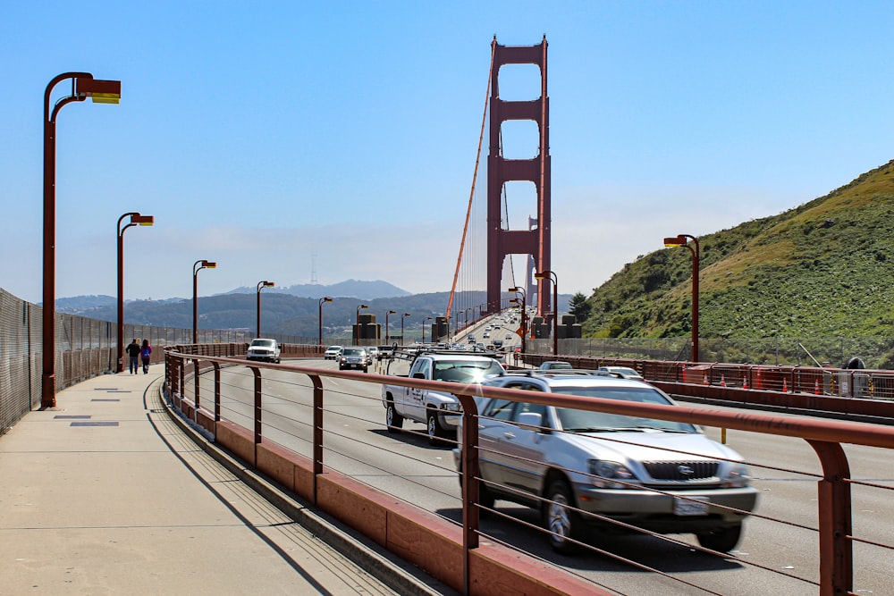 cars driving on a bridge over a body of water