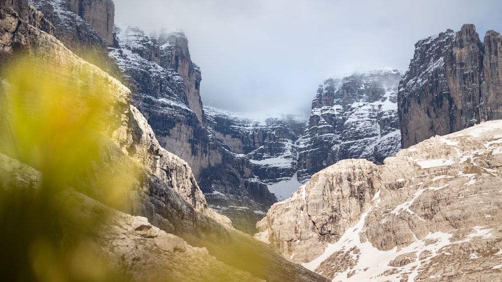 a view of a mountain range with snow on it