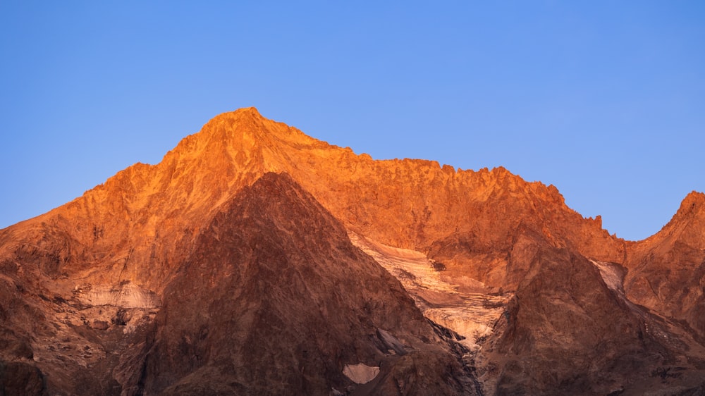 a very tall mountain with a sky background