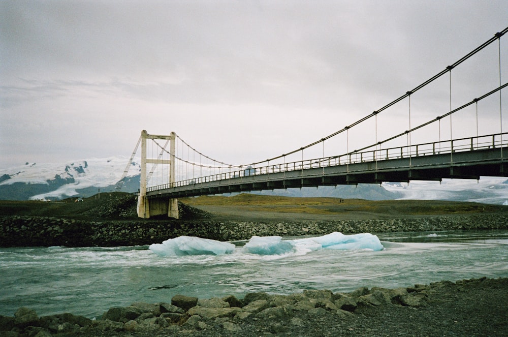 a suspension bridge over a body of water