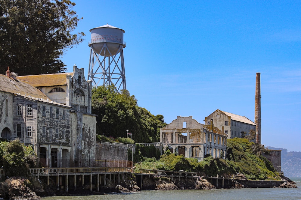 an old building with a water tower in the background