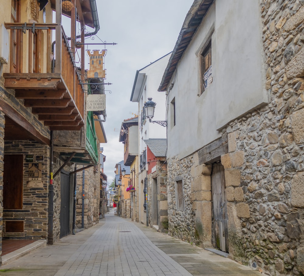 a cobblestone street lined with stone buildings