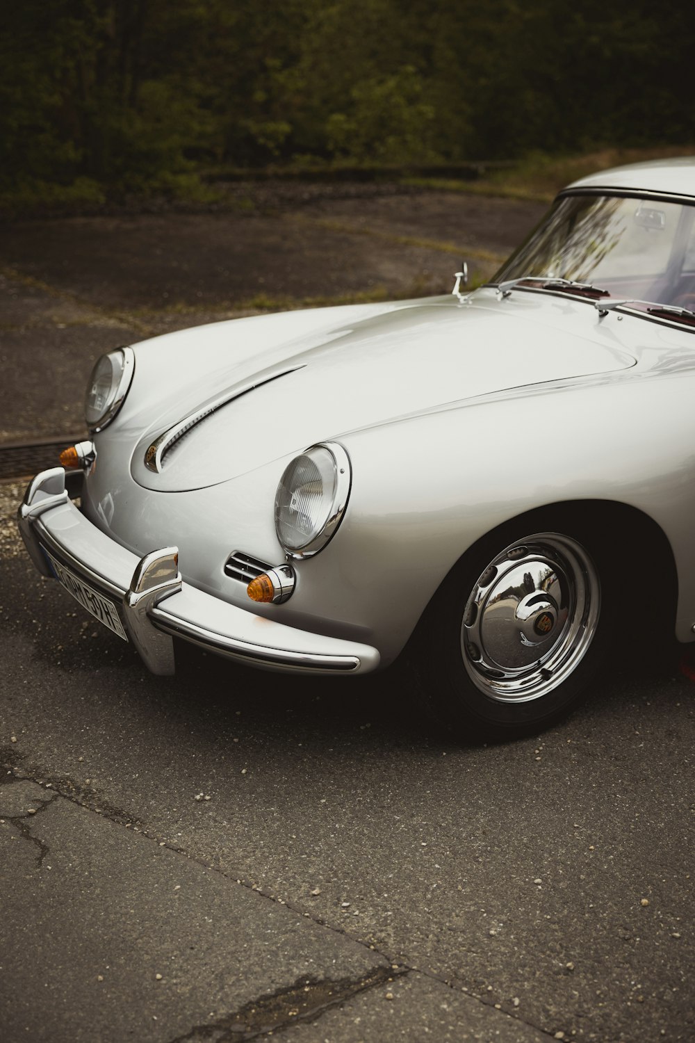 a white sports car parked on the side of the road