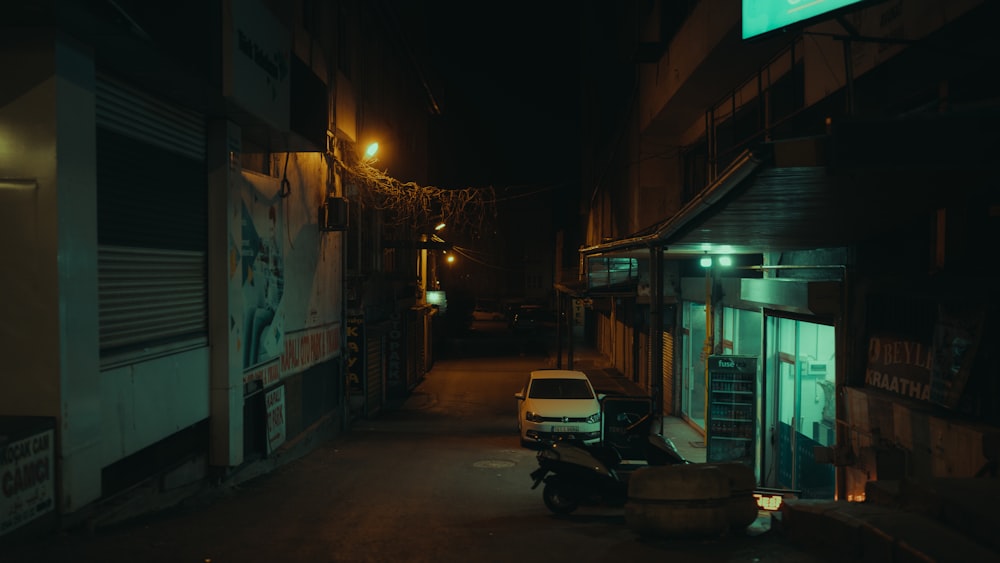 a car parked in a dark alleyway at night