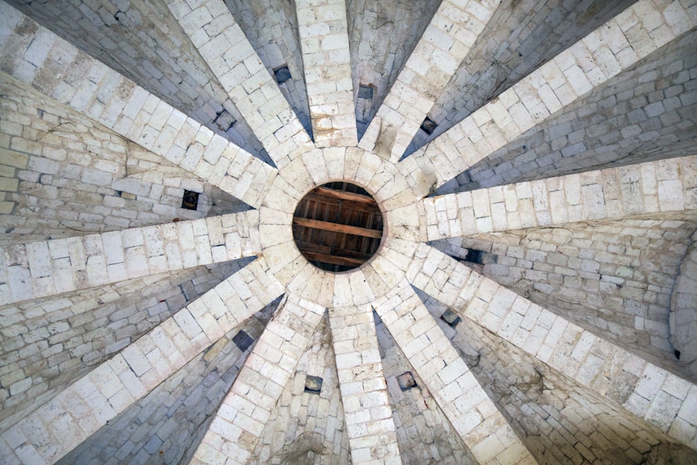 a view of the top of a building with a circular window