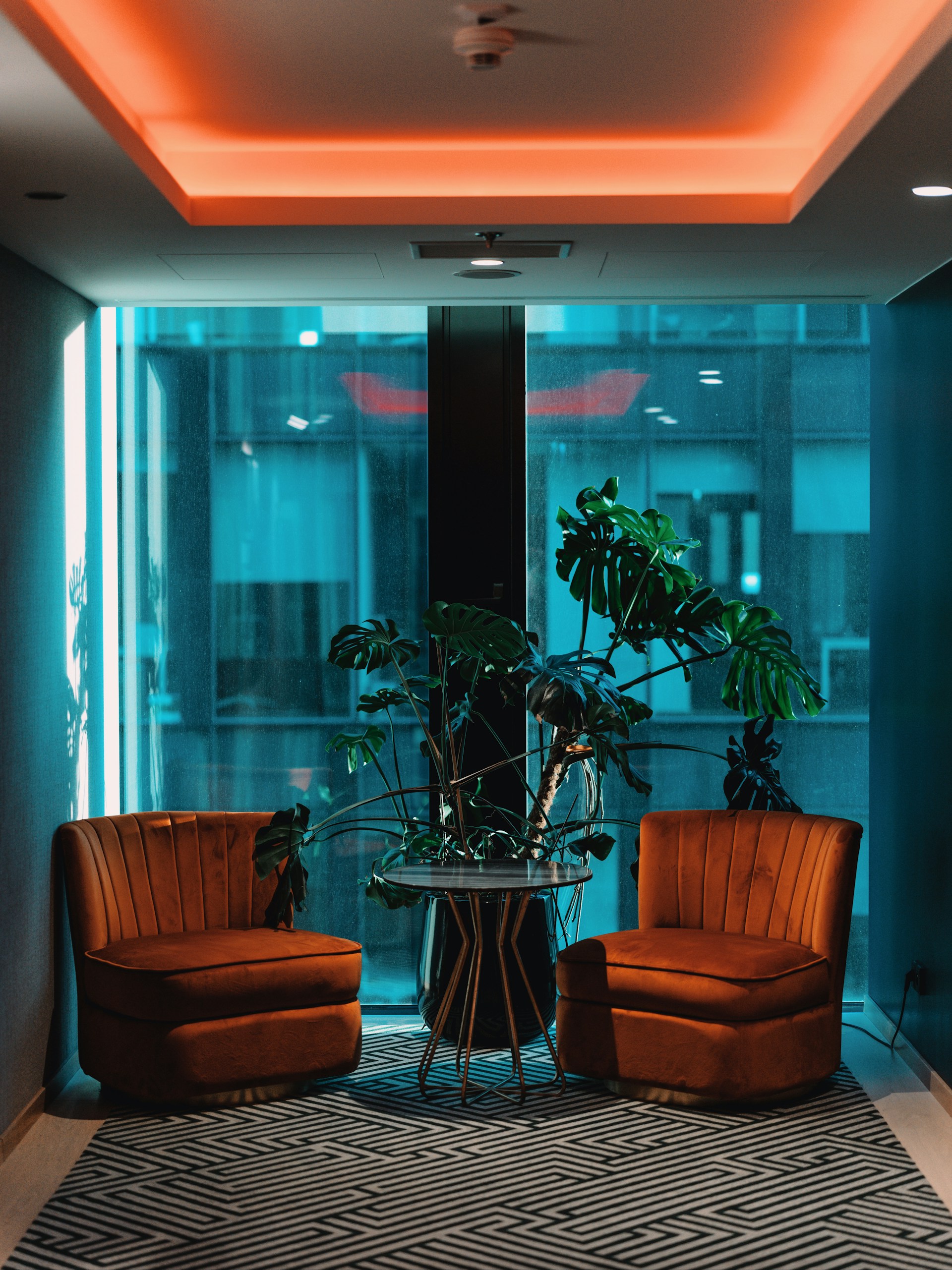 two chairs and a table in a room