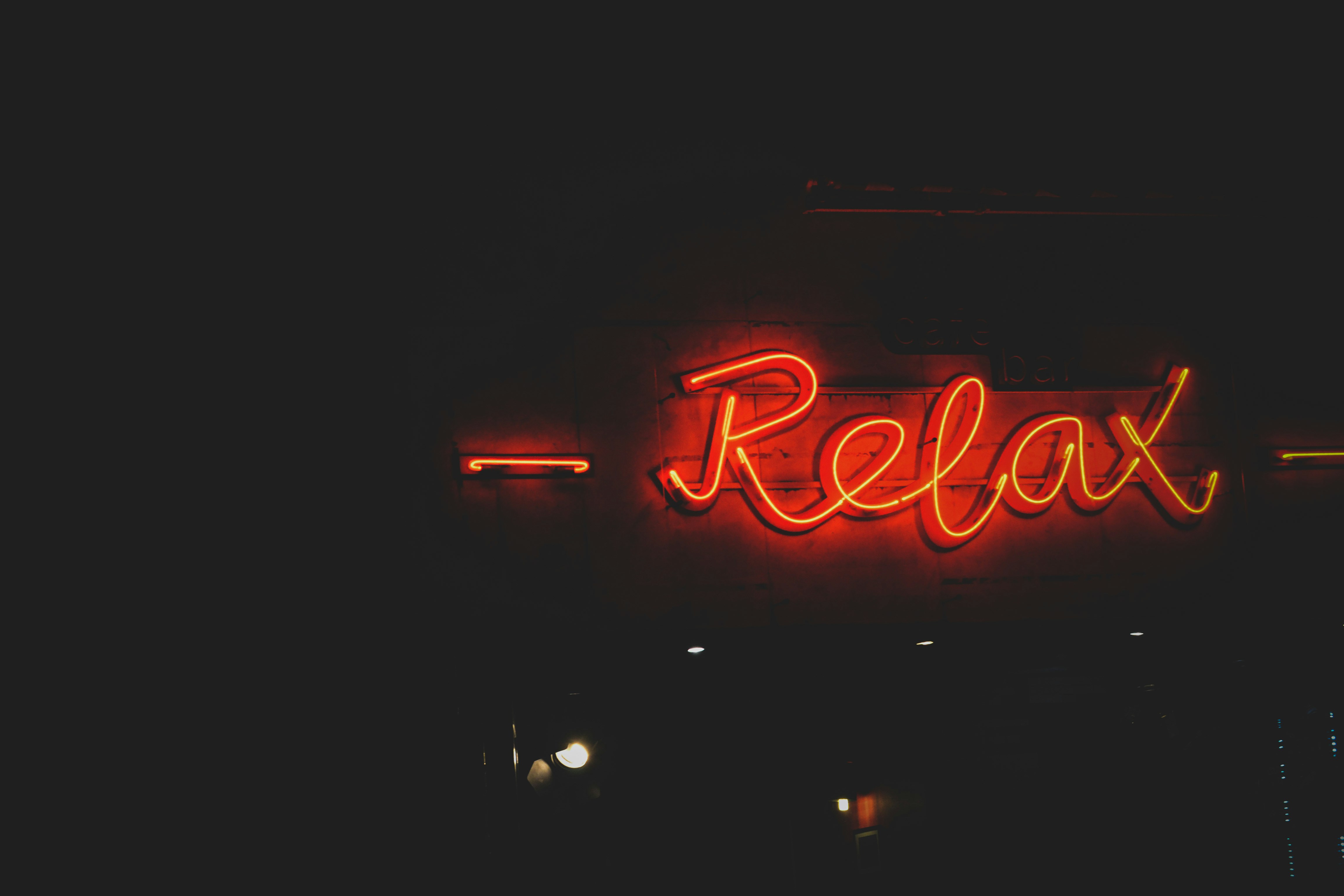 a close up of a neon sign on a building