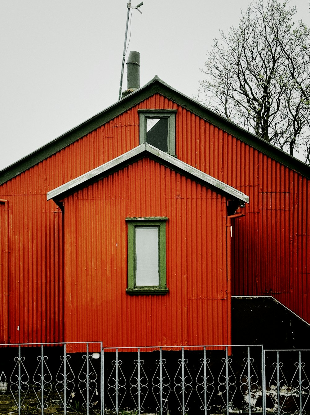 a red building with a clock tower on top of it