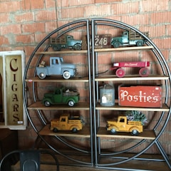 A colorful display of classic wooden toys arranged on a rustic shelf.