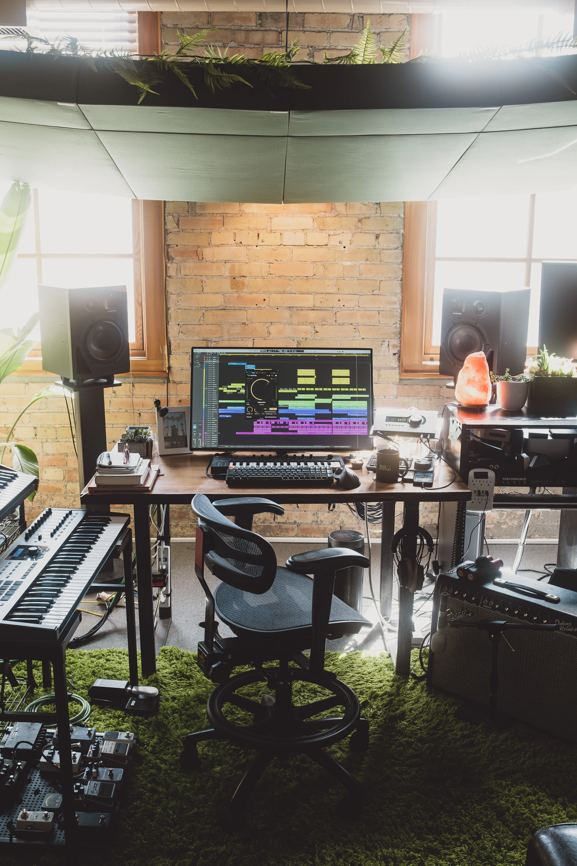 a desk with a keyboard and a monitor