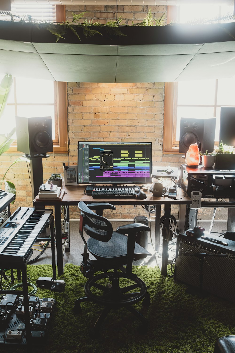 a desk with a keyboard and a monitor