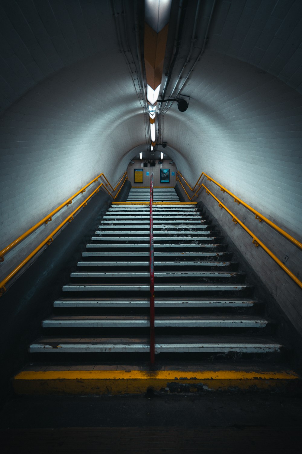 a very long and narrow stairway in a building