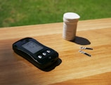 Portable hormone reader and disposable sensor strips laid out on a table.