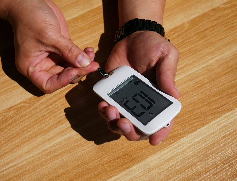 a person holding an electronic device in their hands