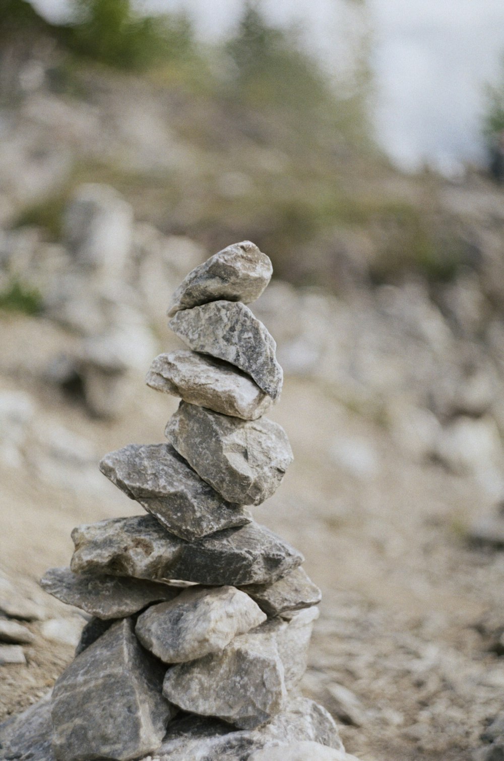 a pile of rocks sitting on top of a rocky hillside