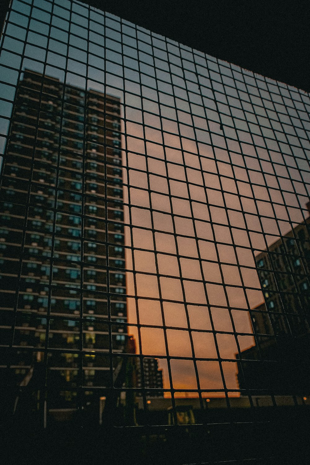 a tall building with a lot of windows next to it