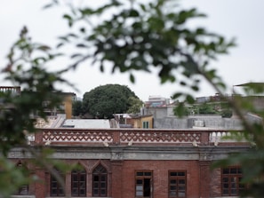Historic brick building with charming architectural details in an urban setting.
