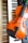 A violin rests on a keyboard, with black and white keys visible beneath the orange-brown body of the violin. Part of an electronic instrument with buttons and dials is also visible.