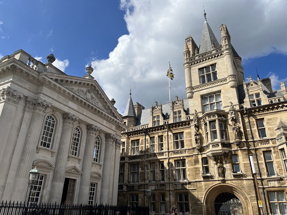 a large building with many windows and a gate