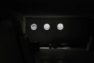 A spacious storage unit filled with neatly stacked furniture and boxes under soft lighting.