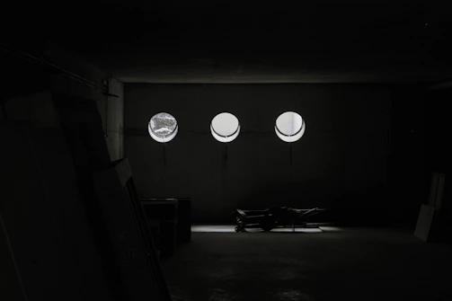 A tidy living room cleared out by professional movers under warm natural light.