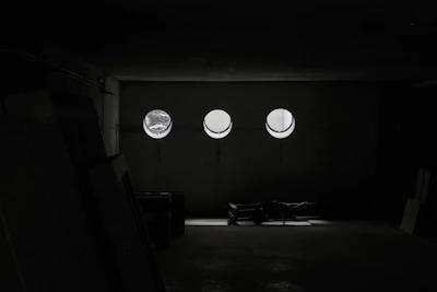 Minimalist archival room with rows of organized document boxes under soft lighting.