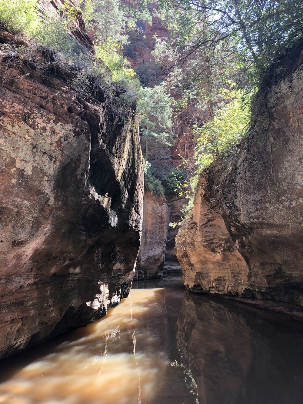 a river flowing between two large rocks in a canyon