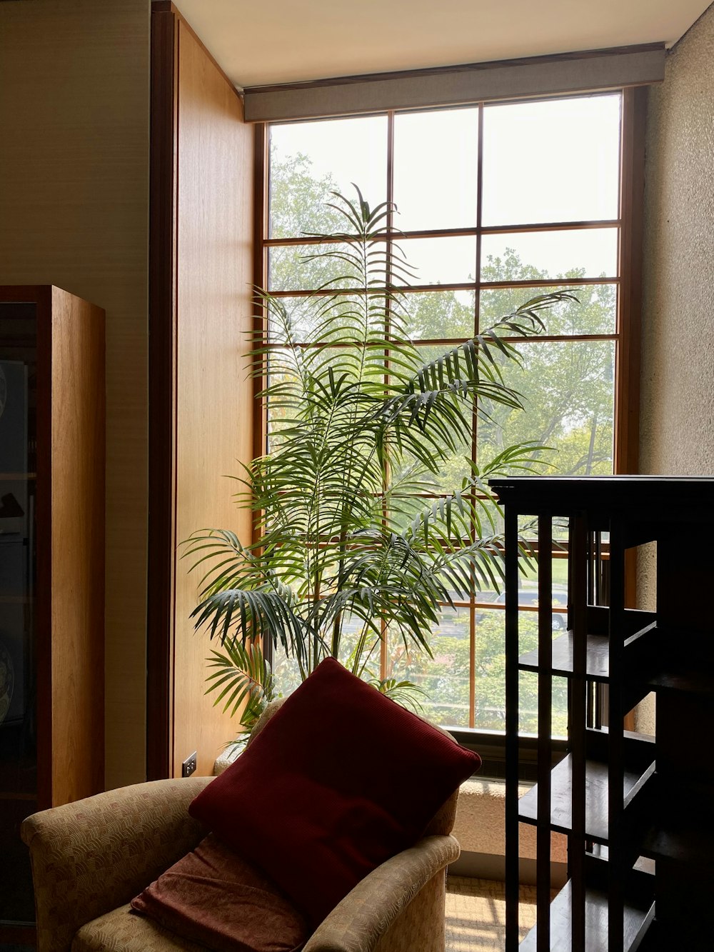 a living room filled with furniture and a large window