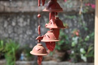 a group of bells hanging from a building