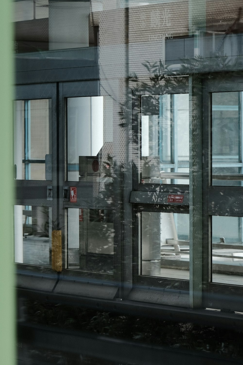 a reflection of a building in a window